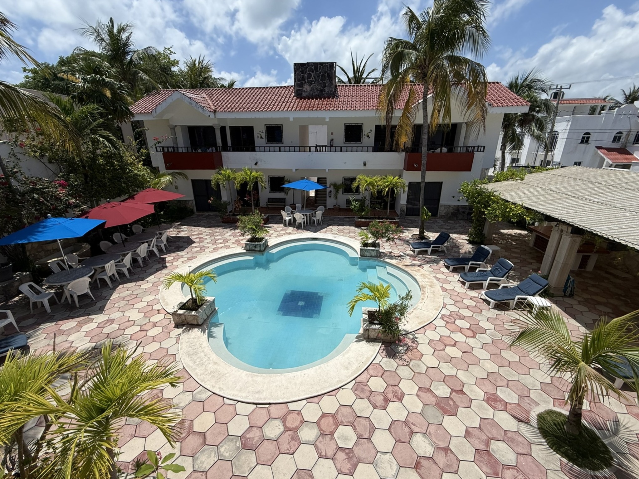 Retreat villa with pool courtyard surrounded by palm trees
